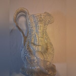 Vintage Ceramic Pitcher with Intricate Design